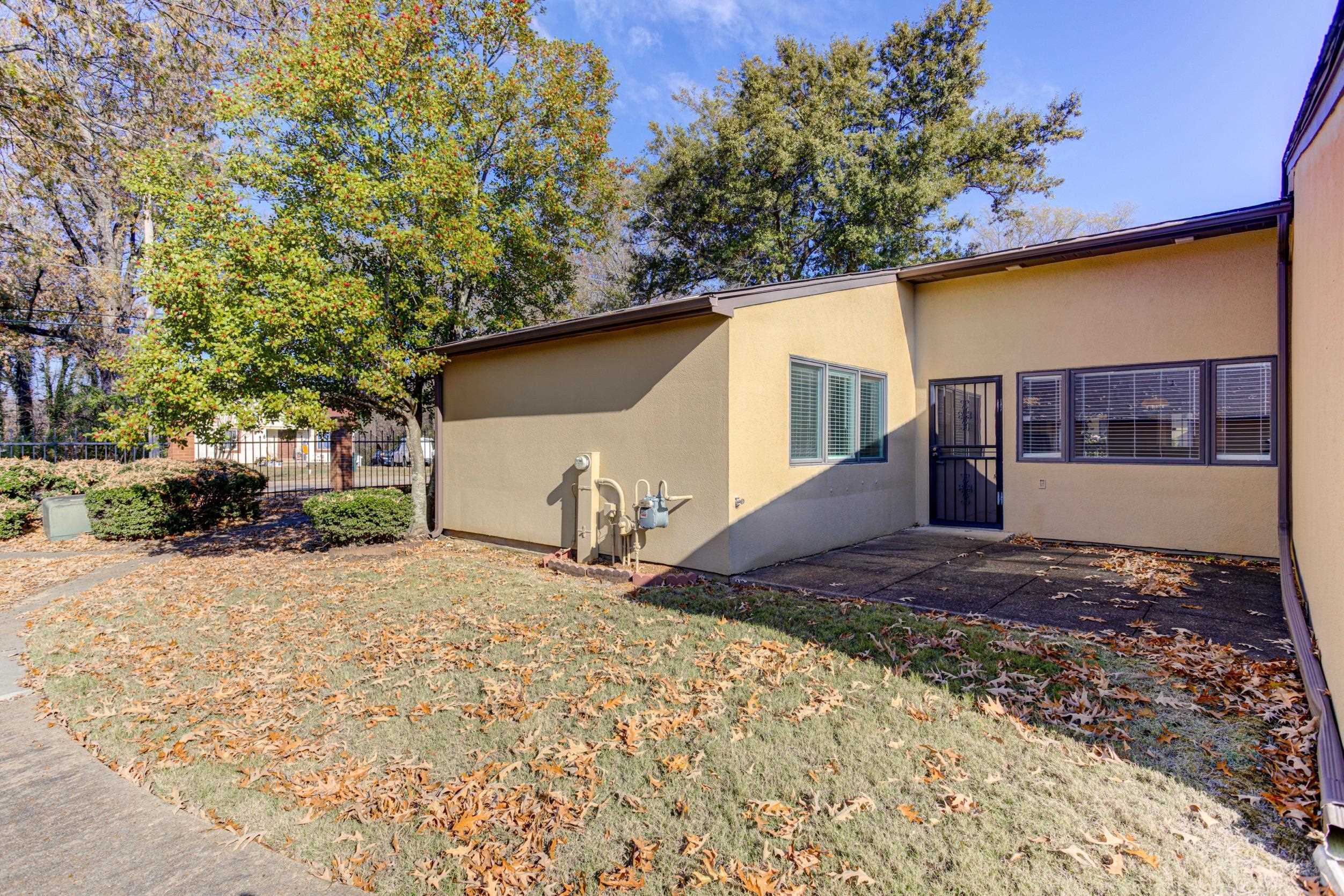 5013 Scheibler Road, Unit C1 Memphis, TN 38128 - Photo 20 of 36 View of side of home featuring stucco siding and a patio area