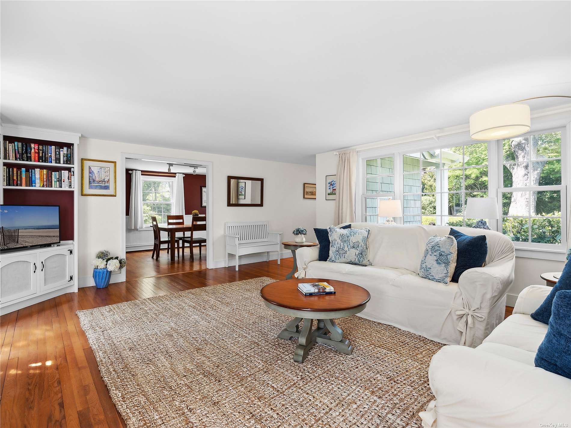 41 East Hampton, undefined 00000 - Photo 3 of 14 a living room with furniture and a flat screen tv