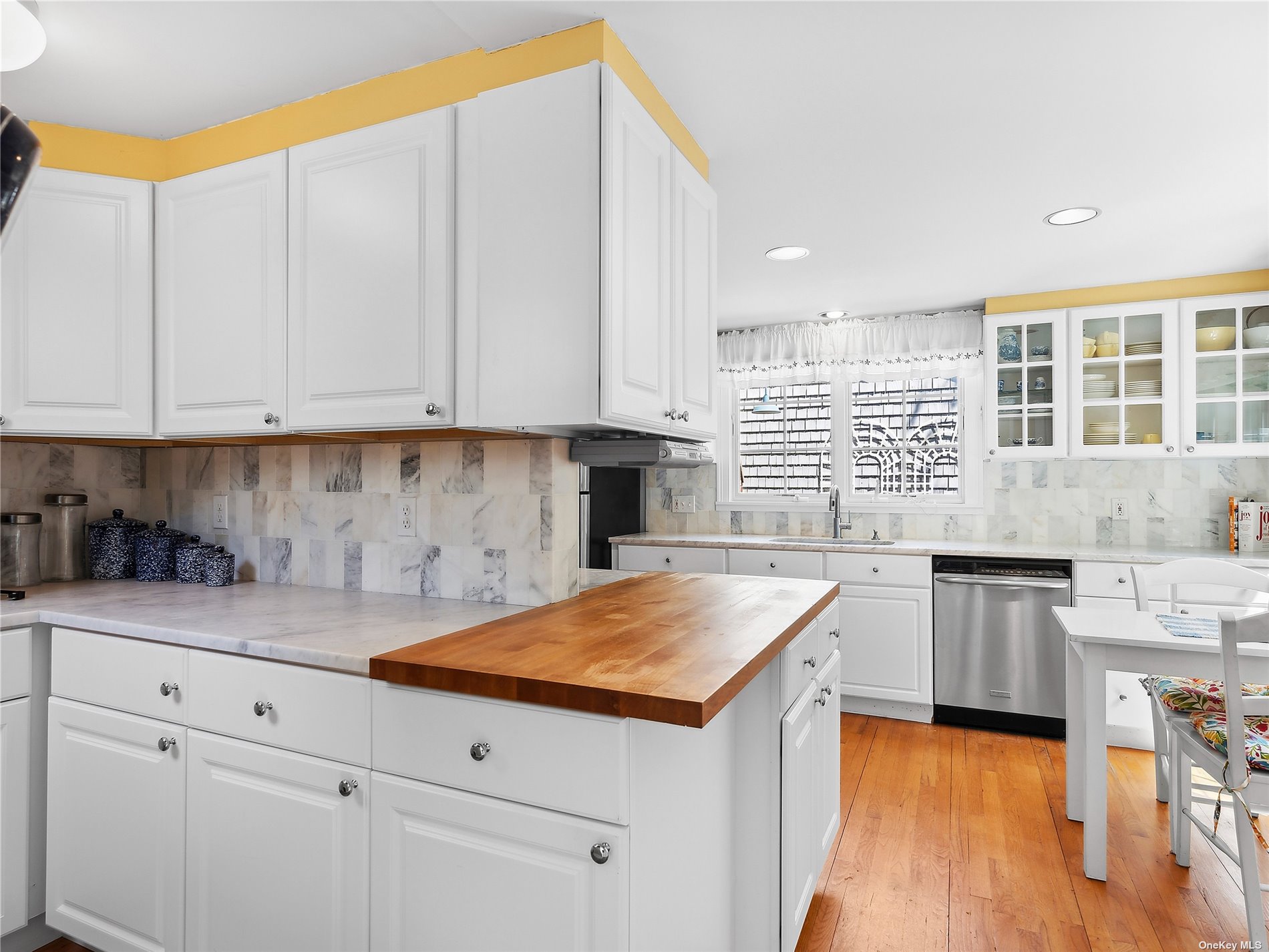 41 East Hampton, undefined 00000 - Photo 5 of 14 a kitchen with granite countertop white cabinets and white appliances