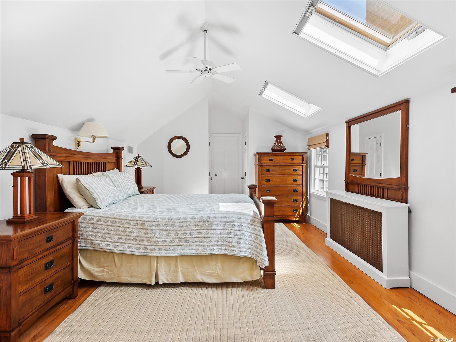 41 East Hampton, undefined 00000 - Photo 8 of 14 a bedroom with a bed and wooden floor