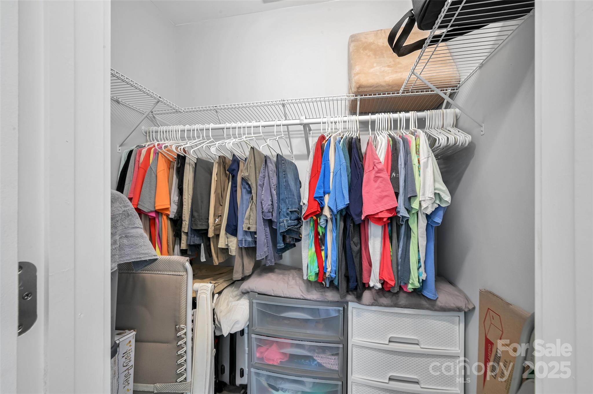 811 Golf Course Road Old Fort, NC 28762 - Photo 15 of 37 a view of walk in closet with clothes