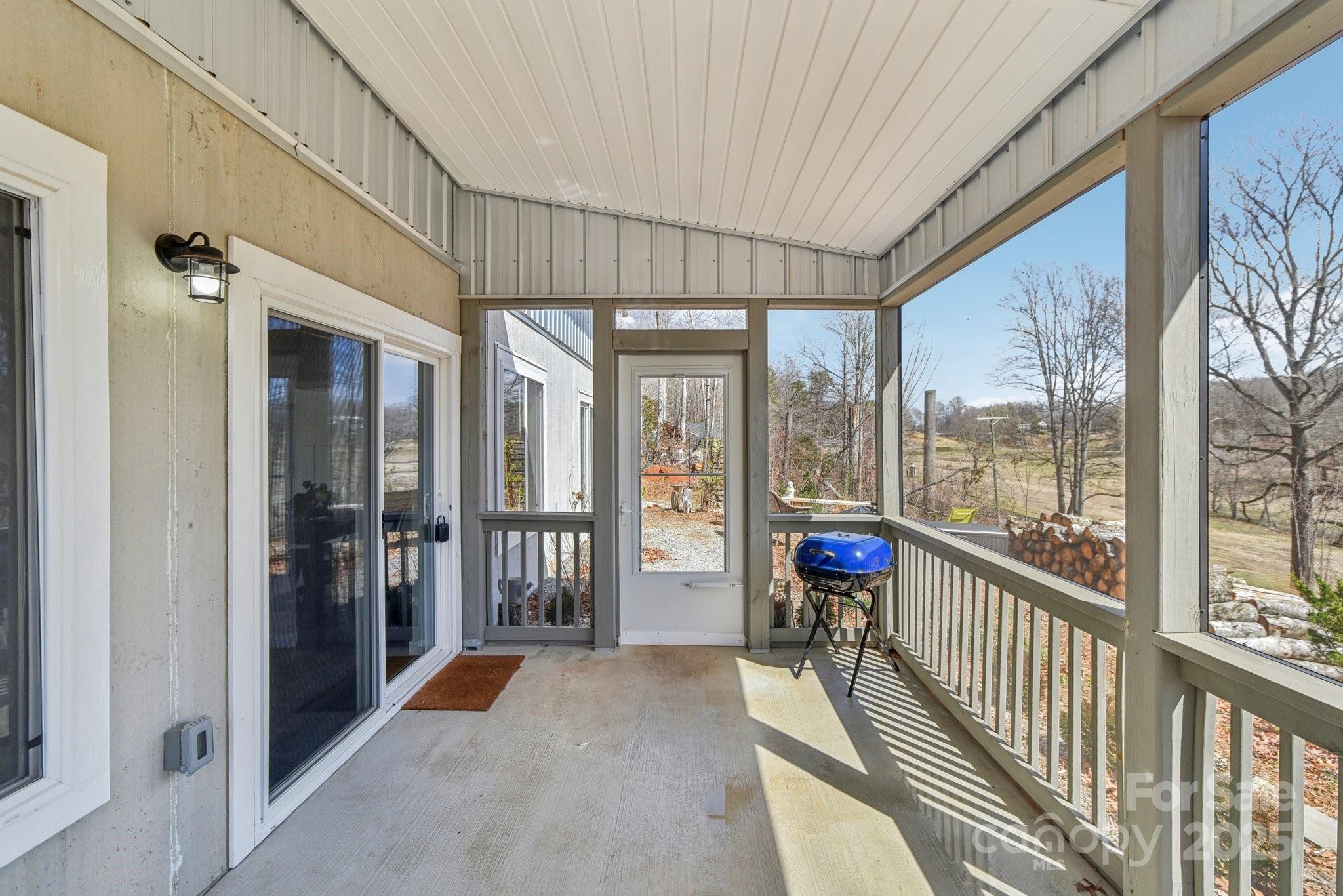 811 Golf Course Road Old Fort, NC 28762 - Photo 24 of 37 a view of a large room with windows