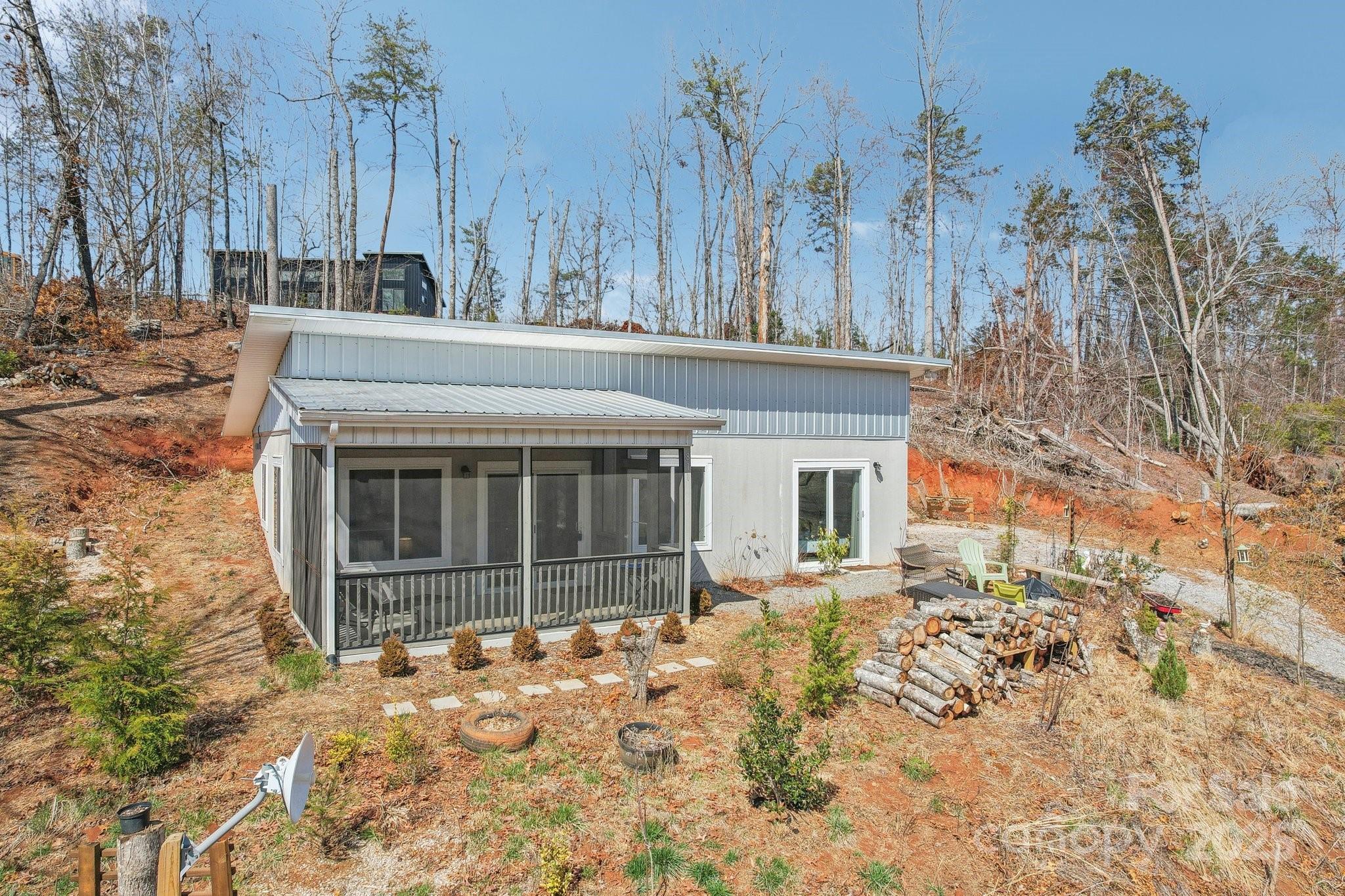 811 Golf Course Road Old Fort, NC 28762 - Photo 33 of 37 a front view of a house with a yard and garage