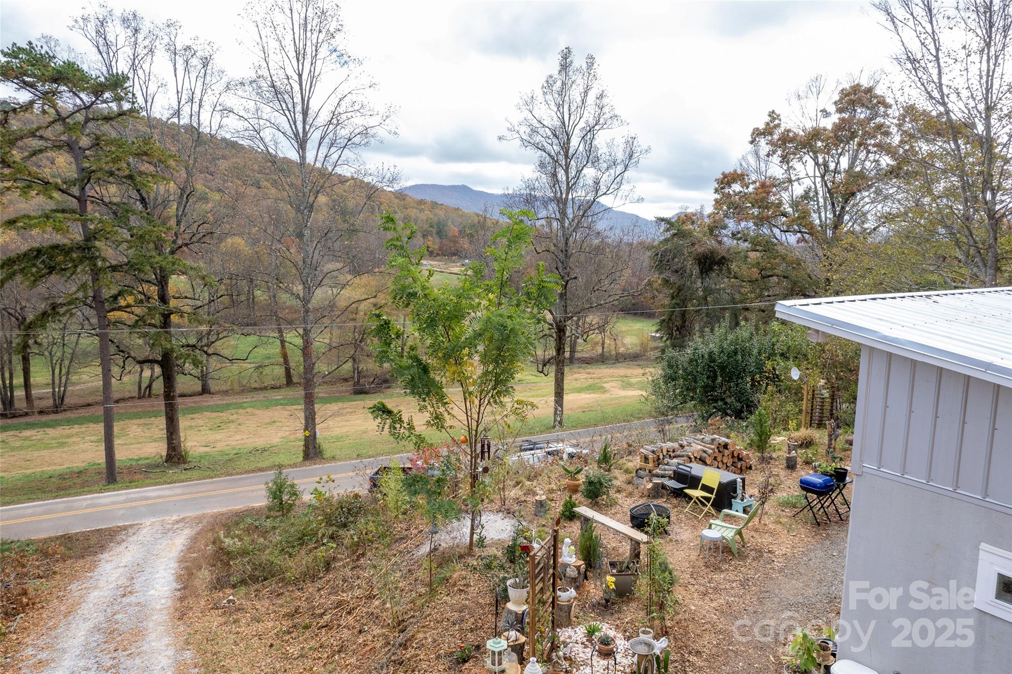 811 Golf Course Road Old Fort, NC 28762 - Photo 34 of 37 a view of a yard with plants and trees