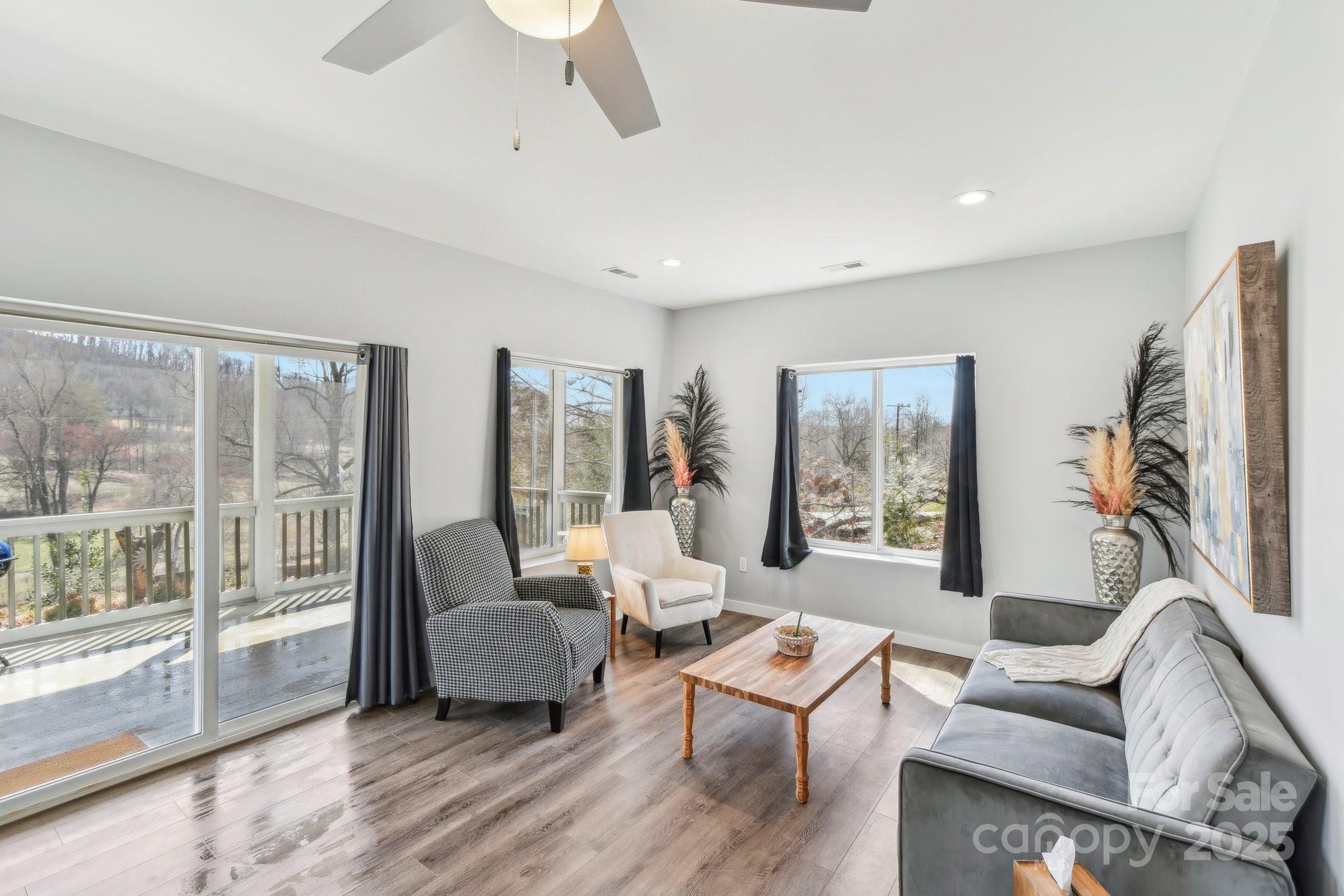 811 Golf Course Road Old Fort, NC 28762 - Photo 5 of 37 a living room with furniture and a large window