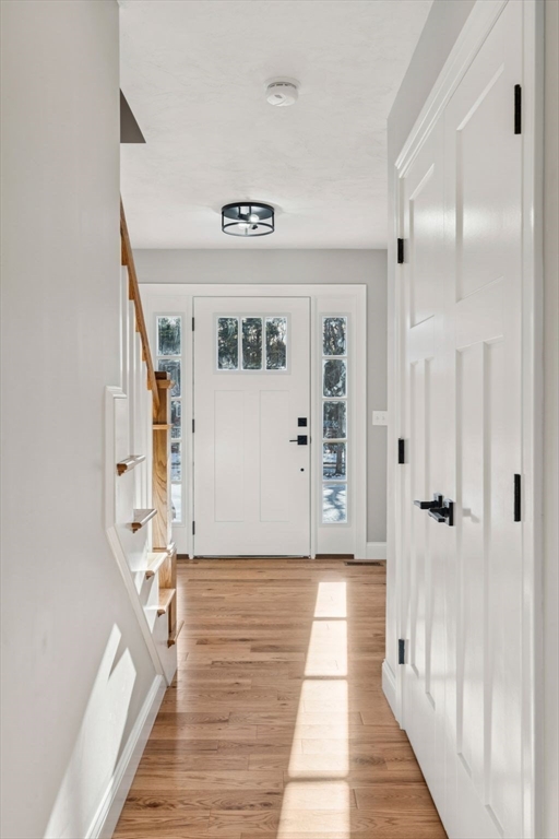 140 Ridge Road Rutland, MA 01543 - Photo 14 of 39 a view of a hallway with wooden floor and staircase