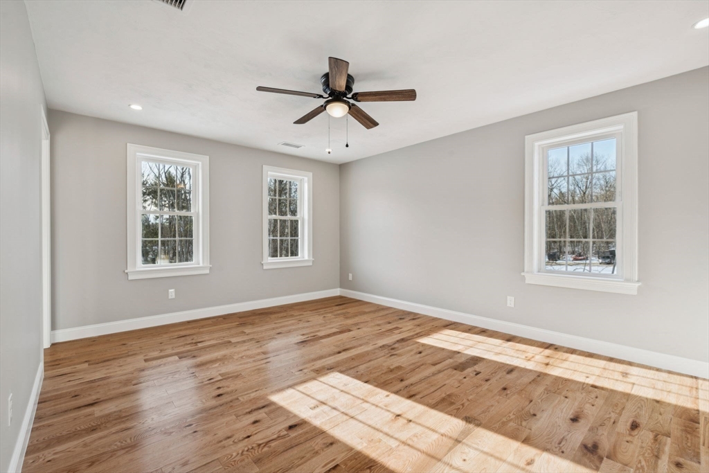 140 Ridge Road Rutland, MA 01543 - Photo 18 of 39 a view of an empty room with wooden floor and a window