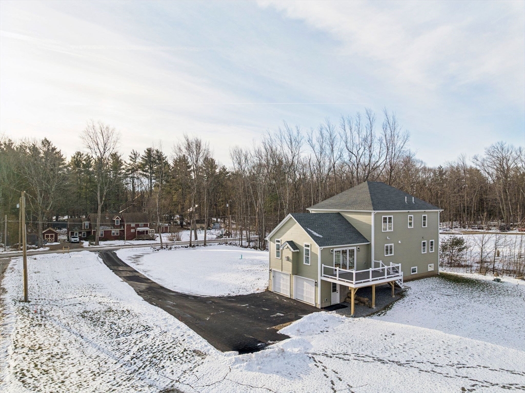 140 Ridge Road Rutland, MA 01543 - Photo 36 of 39 a view of a house with backyard and trees