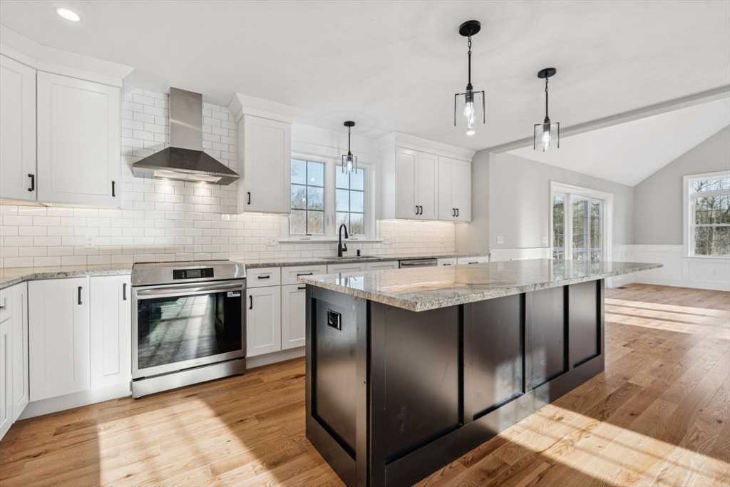 140 Ridge Road Rutland, MA 01543 - Photo 7 of 39 a kitchen with stainless steel appliances granite countertop a stove and a sink