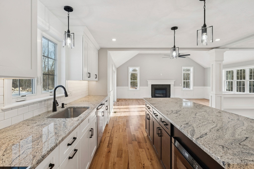 140 Ridge Road Rutland, MA 01543 - Photo 9 of 39 a kitchen with granite countertop a sink stainless steel appliances and a counter top space