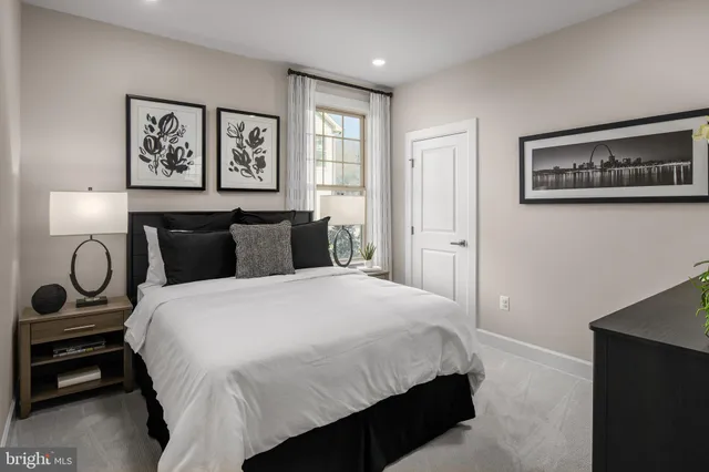 a bedroom with a bed and wall painting