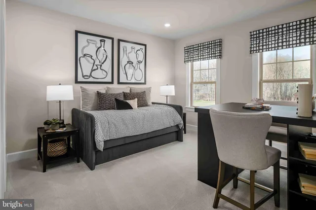 a bedroom with a bed chair and window