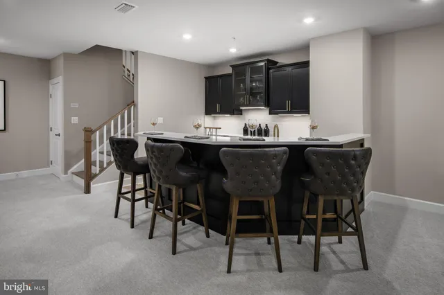 a kitchen with a table and chairs in it