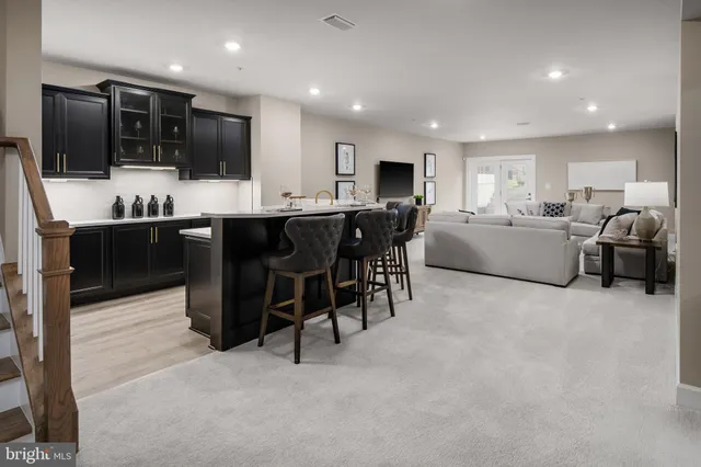 a large kitchen with a table and chairs