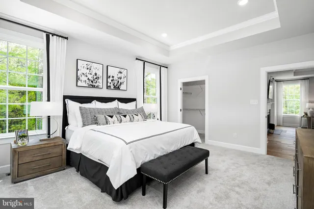 a bedroom with a bed and a couch