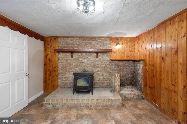 a view of an empty room and fire place