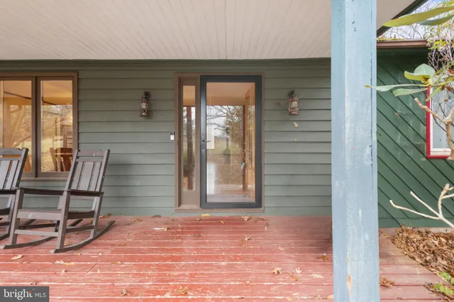 a view of a door and chair in the balcony