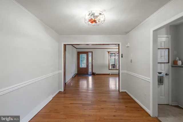 a view of gallery with wooden floor