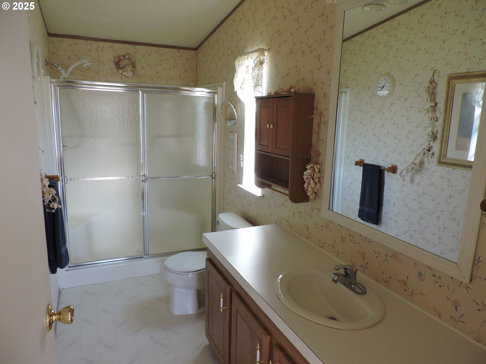 4403 Wagon Wheel Circle Forest Grove, OR 97116 - Photo 9 of 15 a bathroom with a sink a toilet and shower