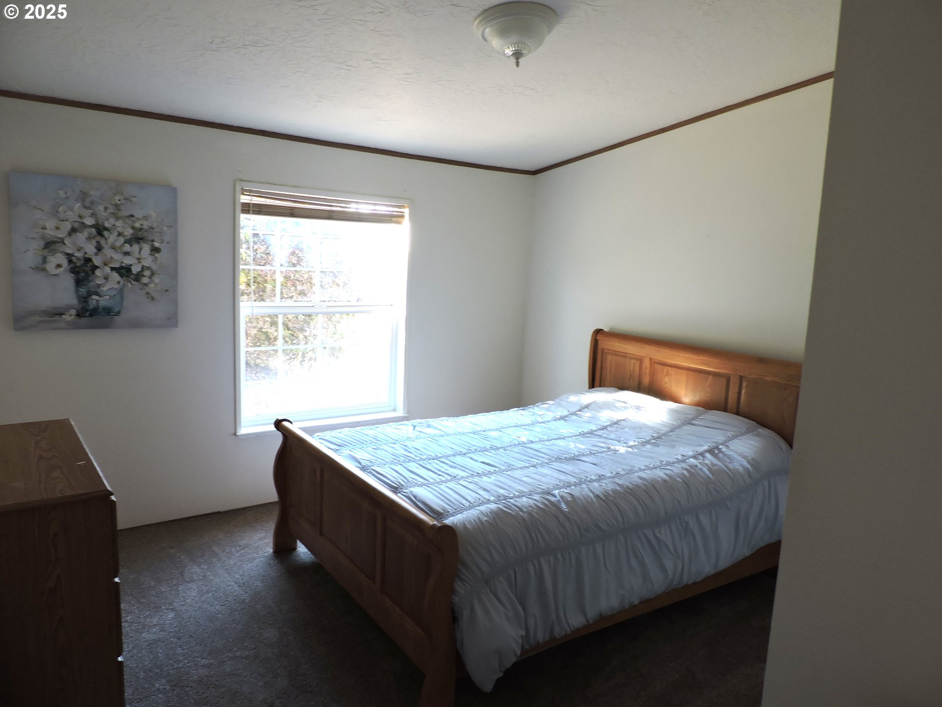 4403 Wagon Wheel Circle Forest Grove, OR 97116 - Photo 10 of 15 a bedroom with a bed and a window