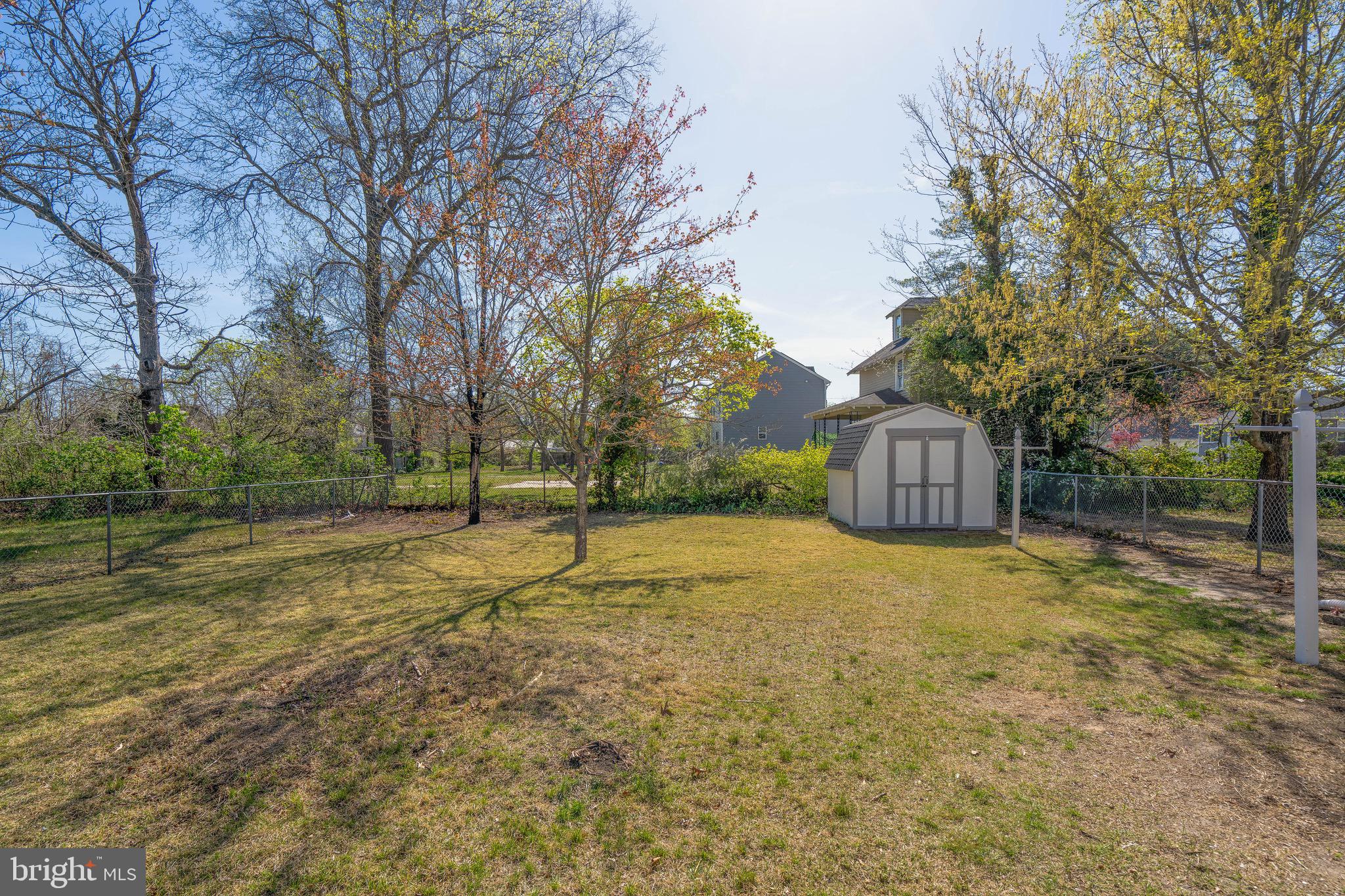 332 Maple Street Millville, NJ 08332 - Photo 23 of 24 a view of a big yard with trees