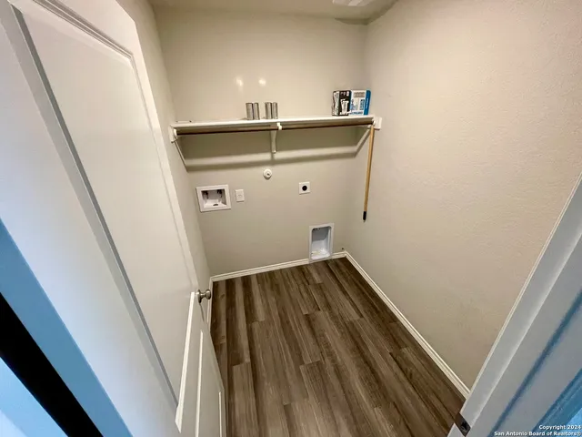 a view of wooden floor with staircase