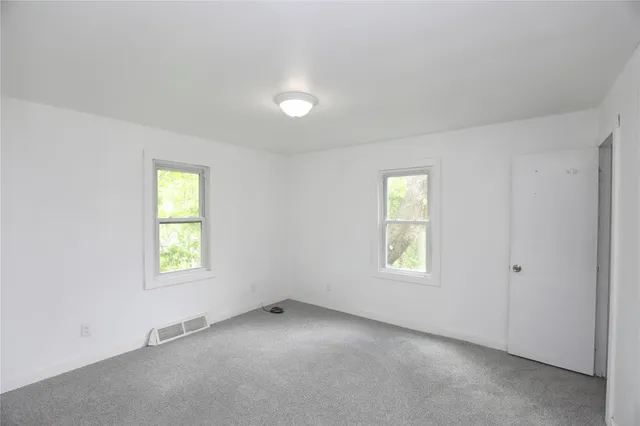 an empty room with windows