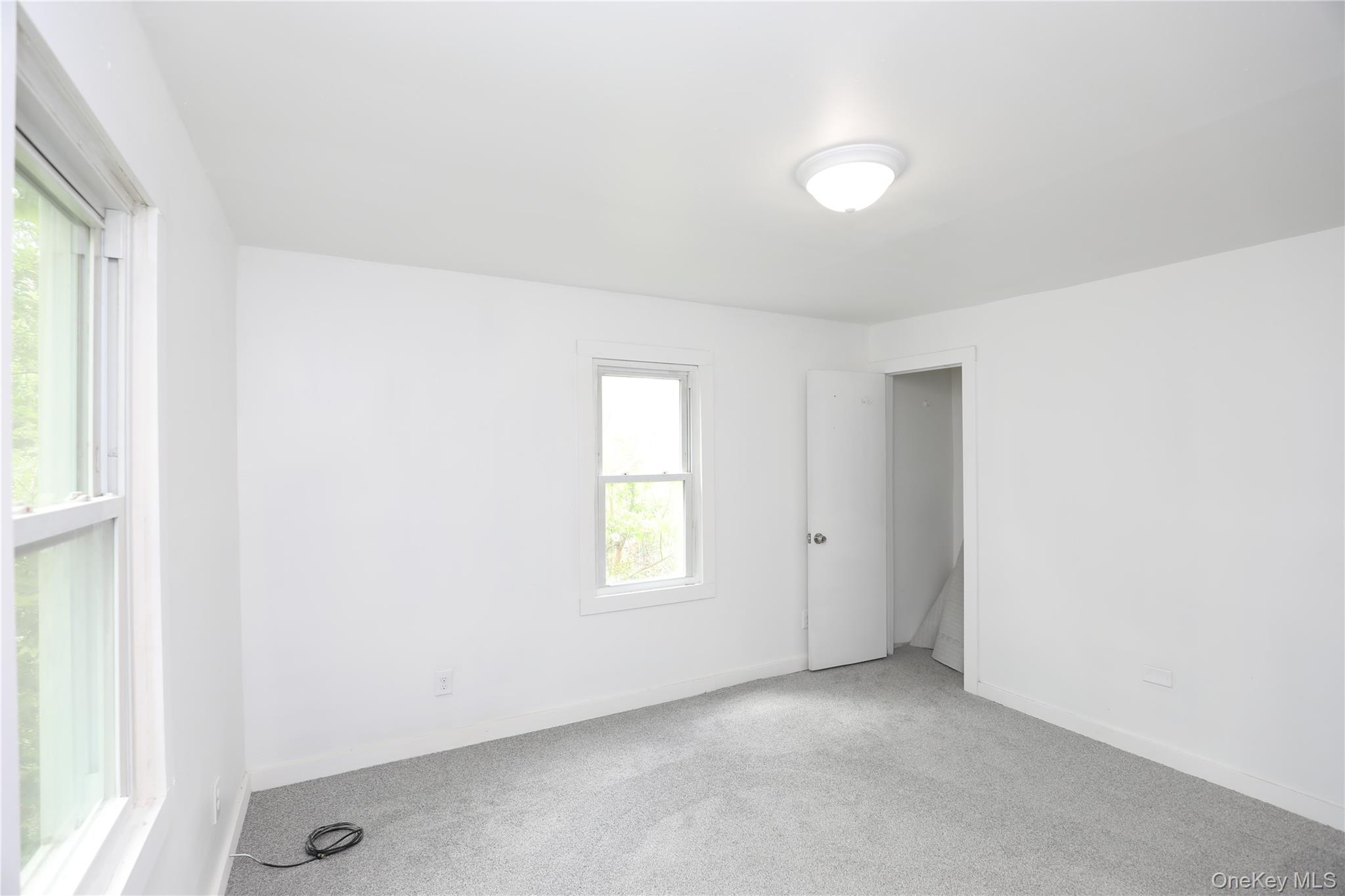 17 Rear Chapel Street Ellenville, NY 12428 - Photo 15 of 24 an empty room with windows and closet