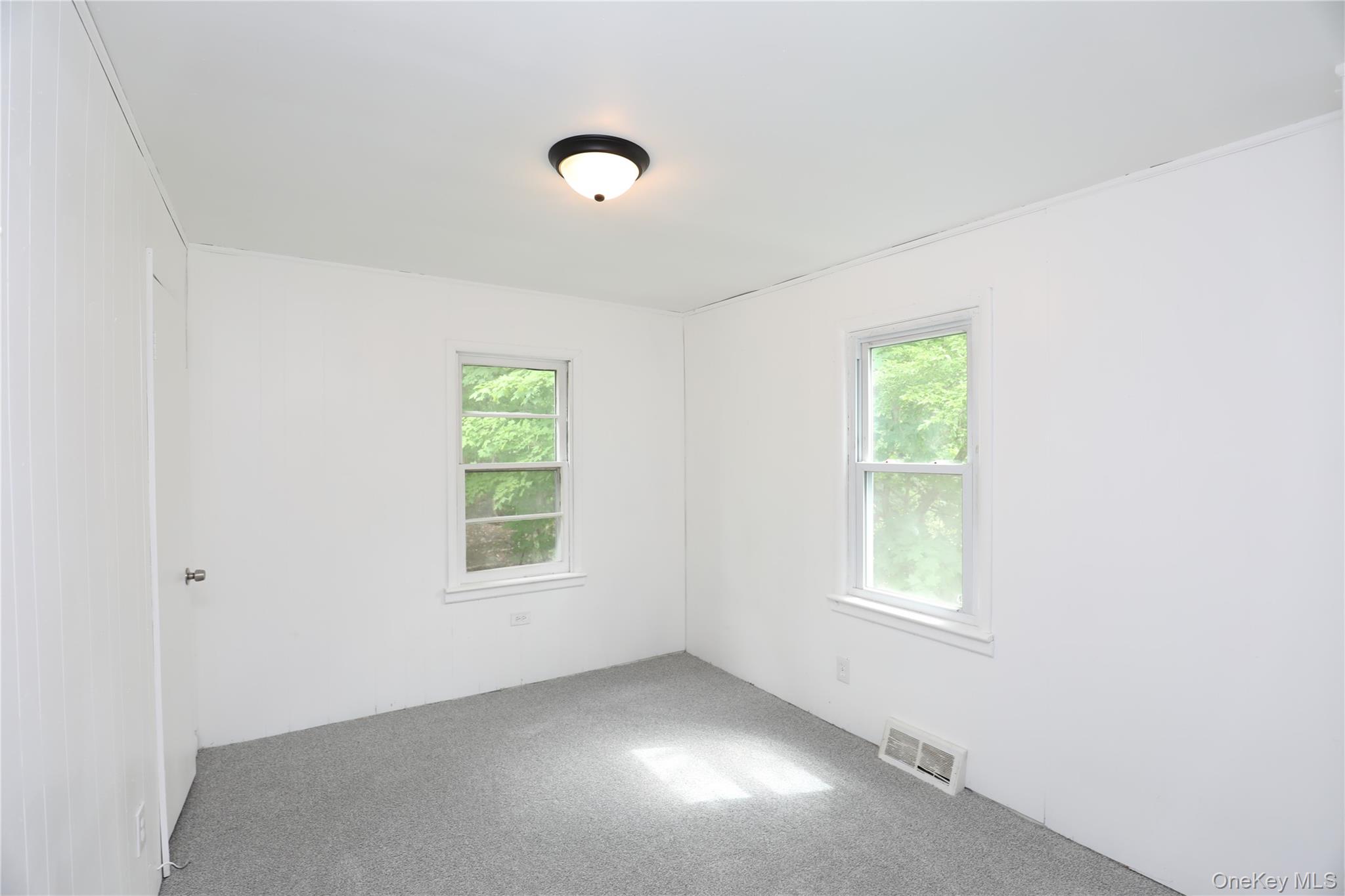 17 Rear Chapel Street Ellenville, NY 12428 - Photo 16 of 24 an empty room with windows