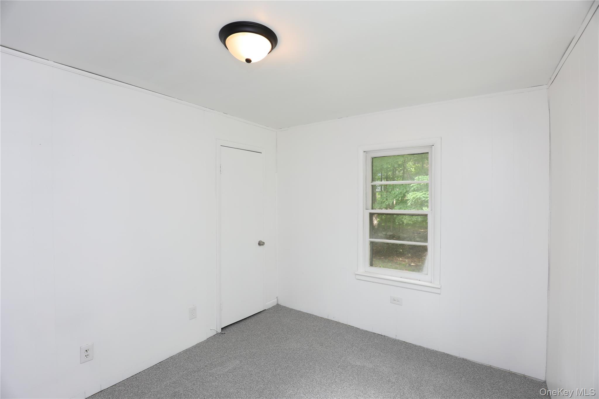 17 Rear Chapel Street Ellenville, NY 12428 - Photo 17 of 24 an empty room with a window