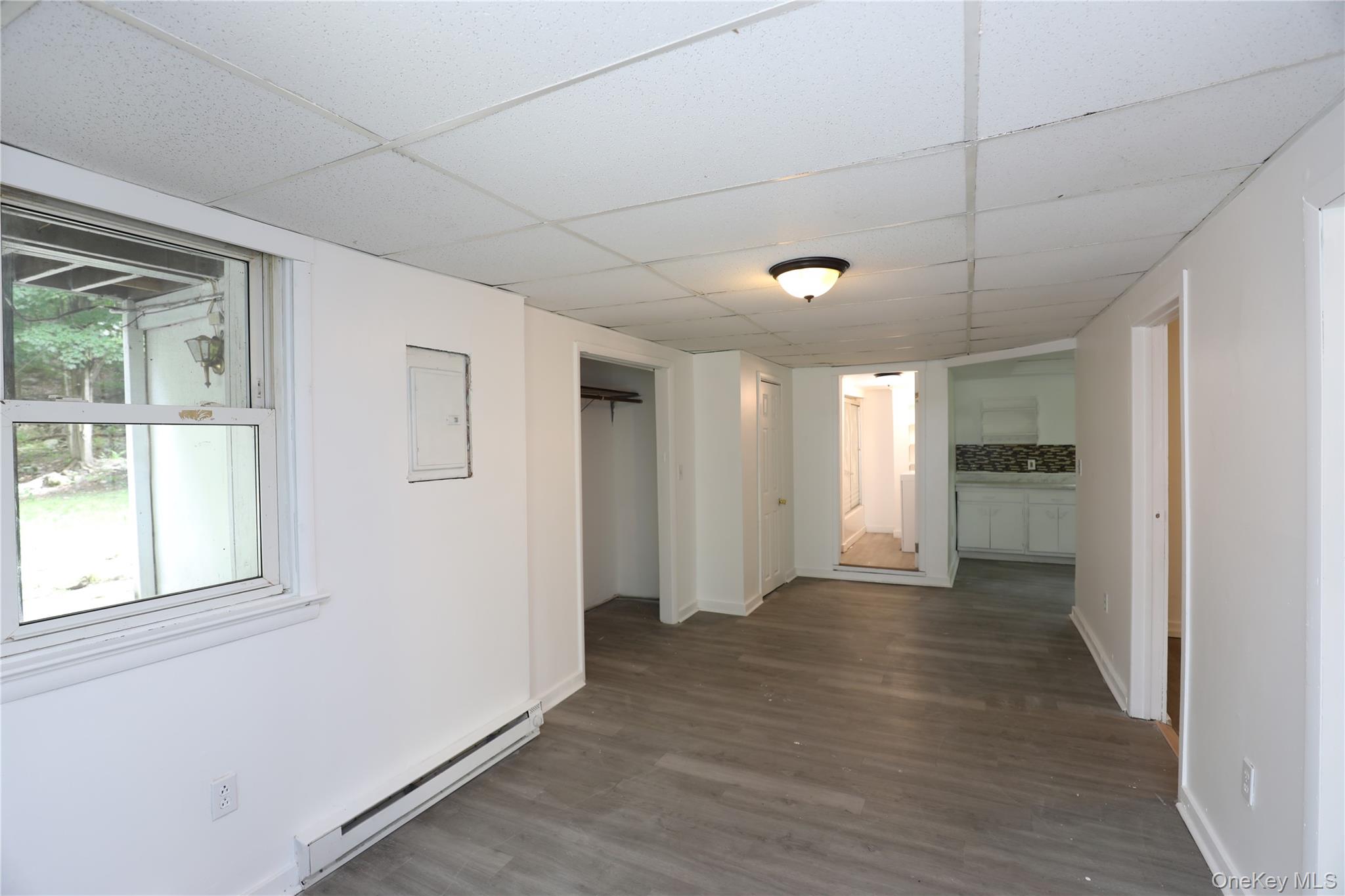 17 Rear Chapel Street Ellenville, NY 12428 - Photo 2 of 24 a view of an empty room with window and wooden floor