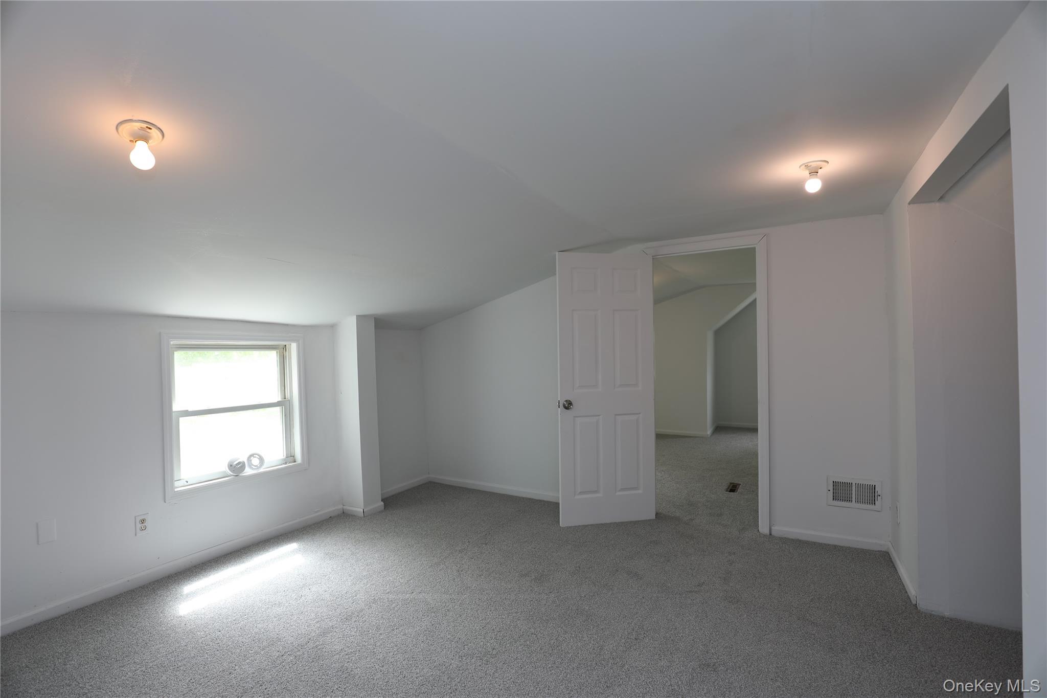 17 Rear Chapel Street Ellenville, NY 12428 - Photo 23 of 24 an empty room with windows and closet