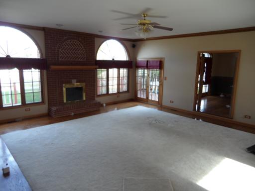 5N585 Dunham Trails Road Wayne, IL 60184 - Photo 3 of 9 an empty room with windows and ceiling fan
