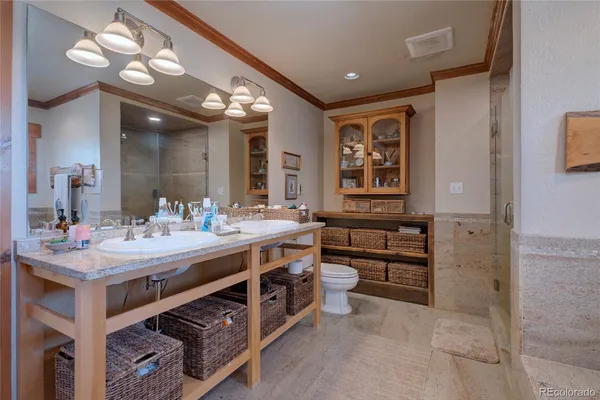 a bathroom with a granite countertop sink mirror and shower