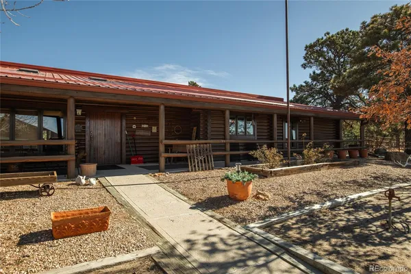 a view of a house with sitting area and furniture