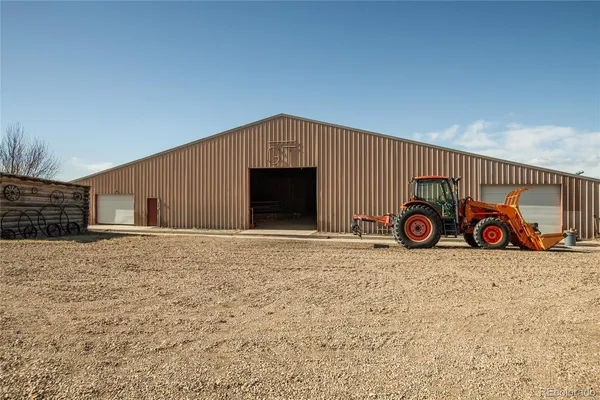 a view of a chairs and table in the patio