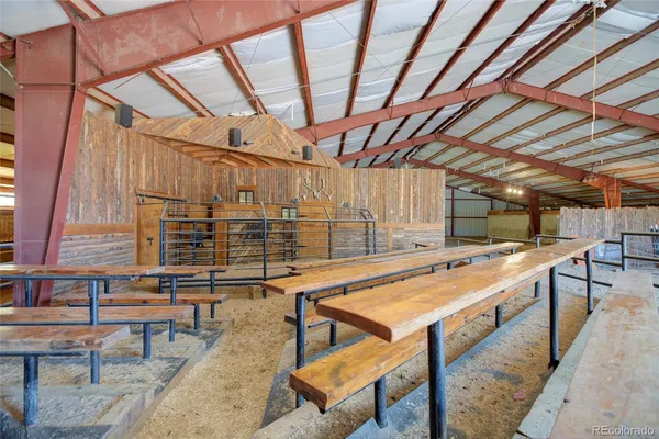 a view of an empty room with wooden walls