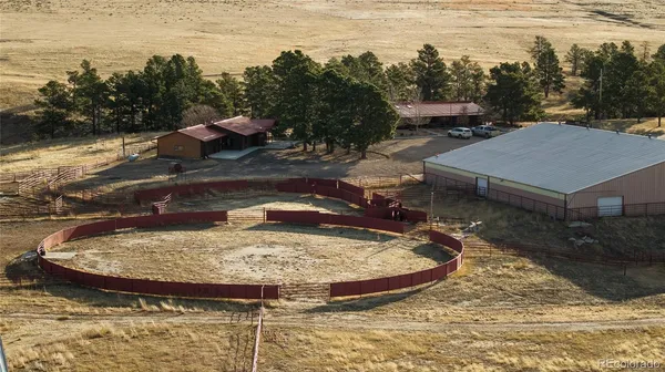 a view of a swimming pool with a yard