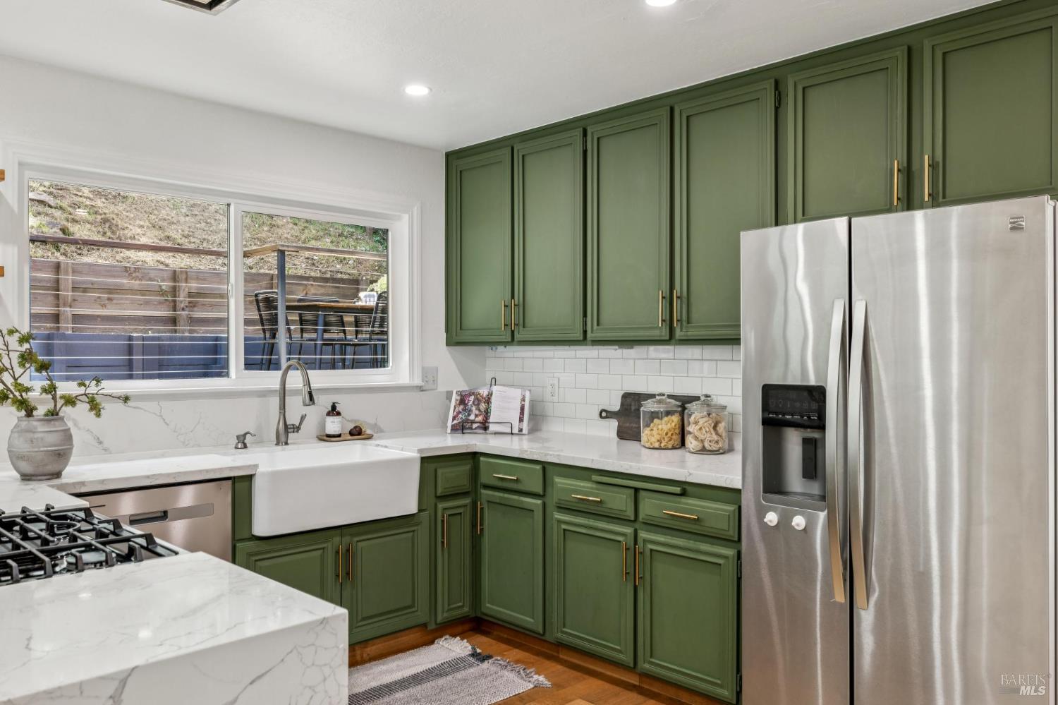 227 Coleman Drive San Rafael, CA 94901 - Photo 20 of 36 a kitchen with stainless steel appliances granite countertop a refrigerator sink and cabinets