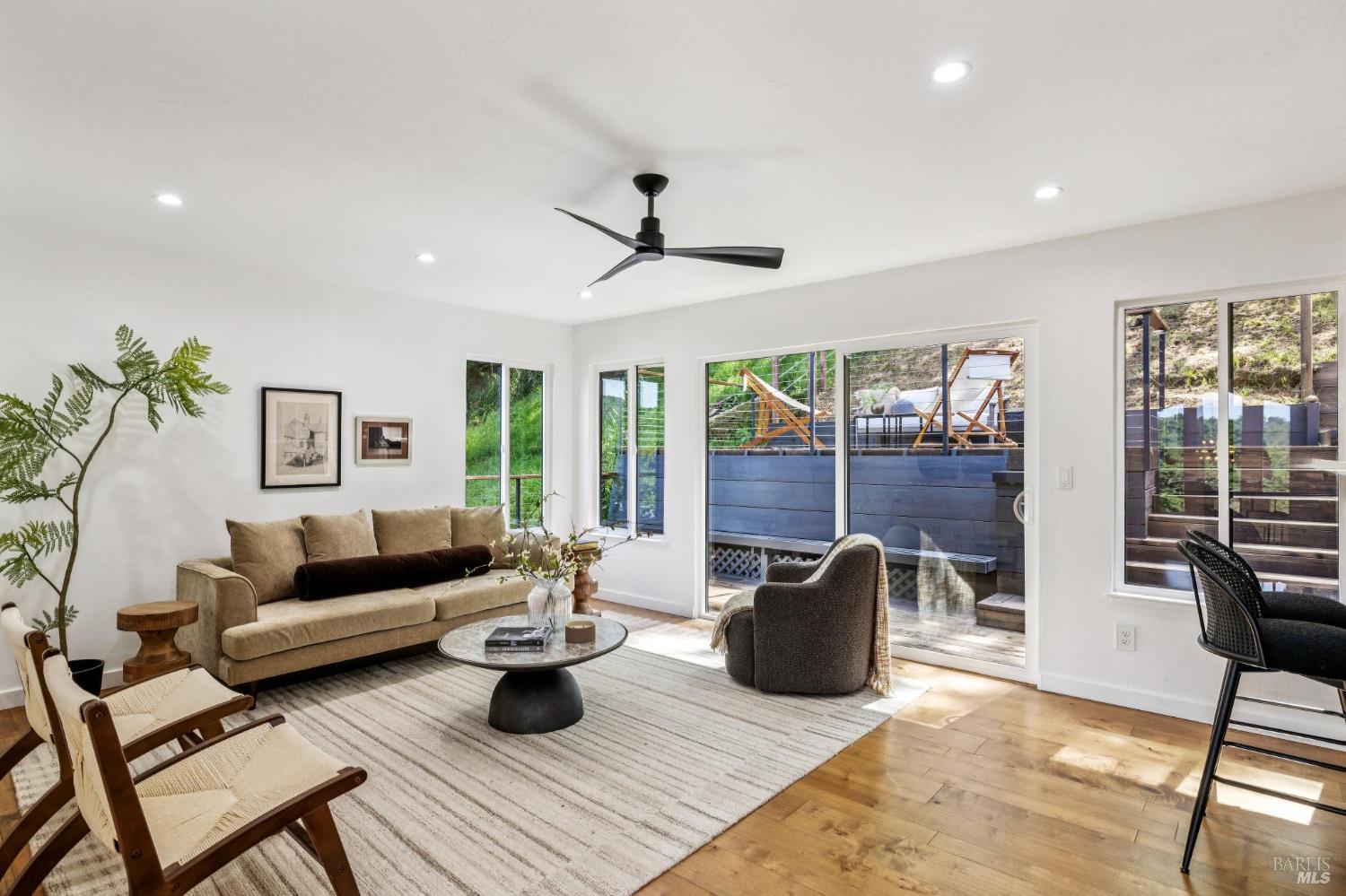 227 Coleman Drive San Rafael, CA 94901 - Photo 22 of 36 a living room with furniture and a floor to ceiling window