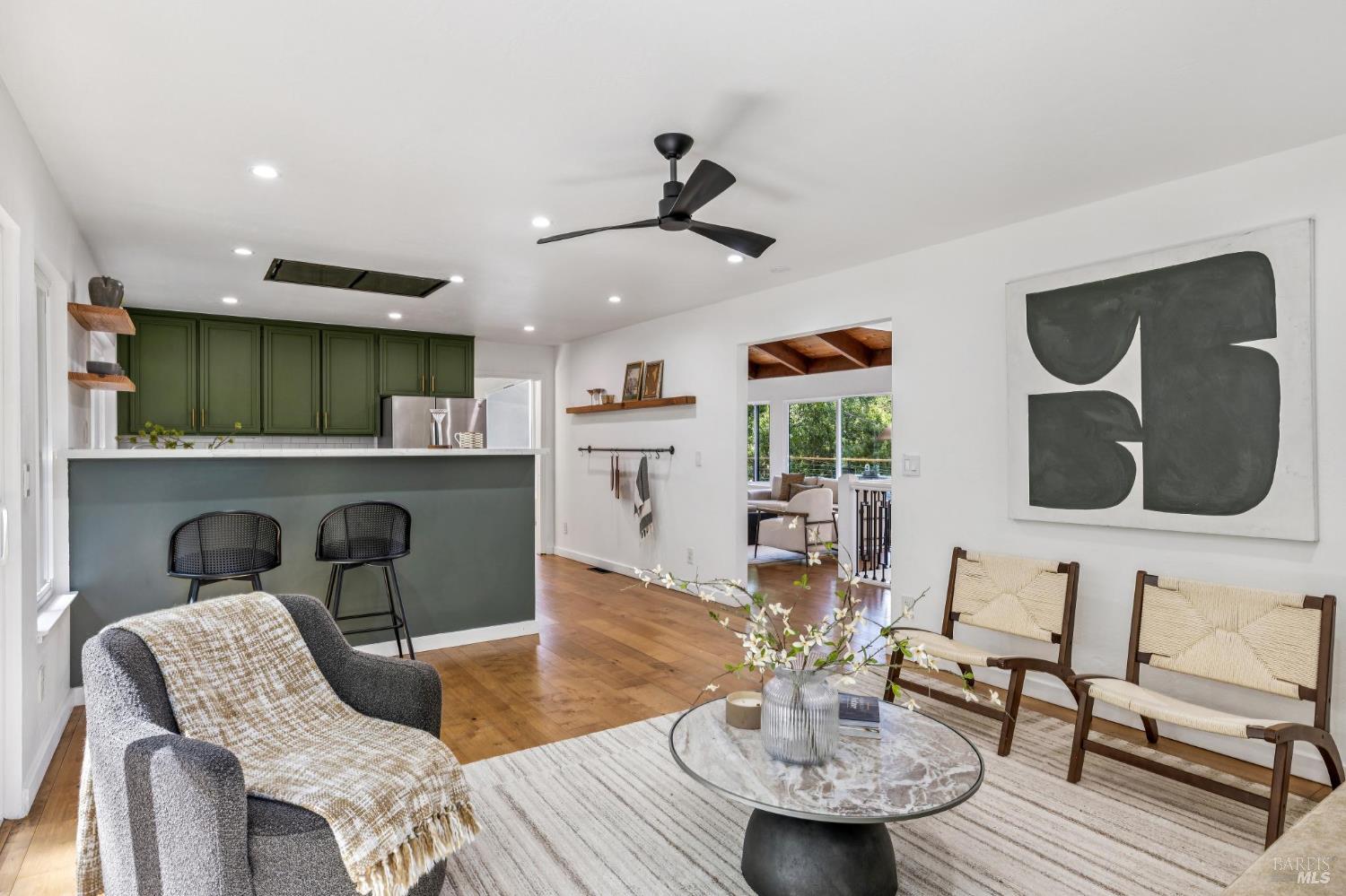227 Coleman Drive San Rafael, CA 94901 - Photo 23 of 36 a living room with furniture and a chandelier
