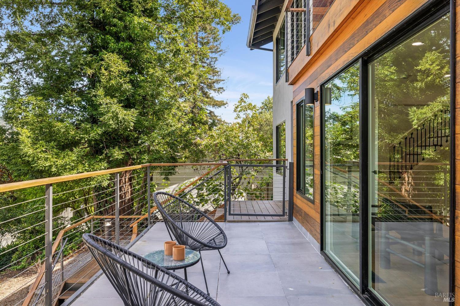 227 Coleman Drive San Rafael, CA 94901 - Photo 33 of 36 a view of a balcony with chairs and wooden floor