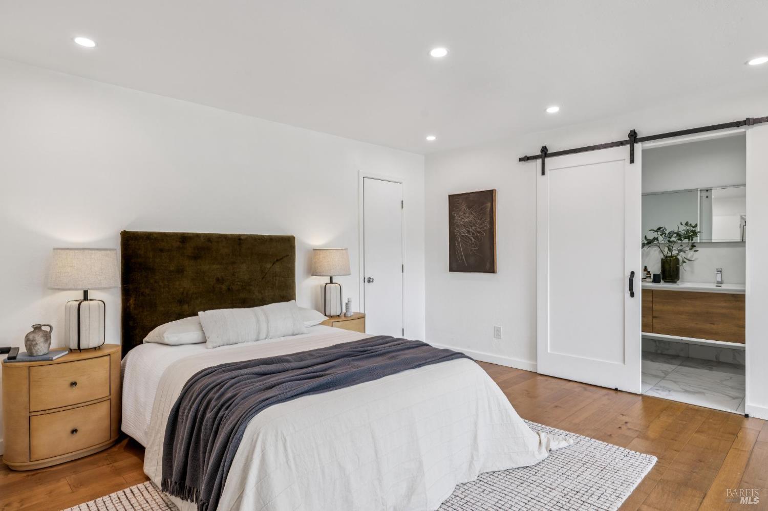 227 Coleman Drive San Rafael, CA 94901 - Photo 5 of 36 a bedroom with a bed and a walk in closet