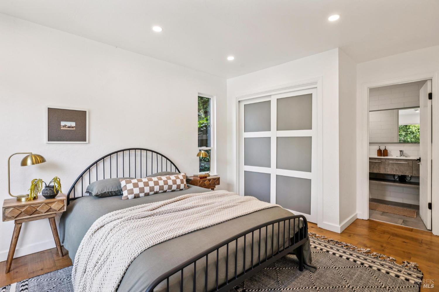 227 Coleman Drive San Rafael, CA 94901 - Photo 7 of 36 a bedroom with a large bed and a window