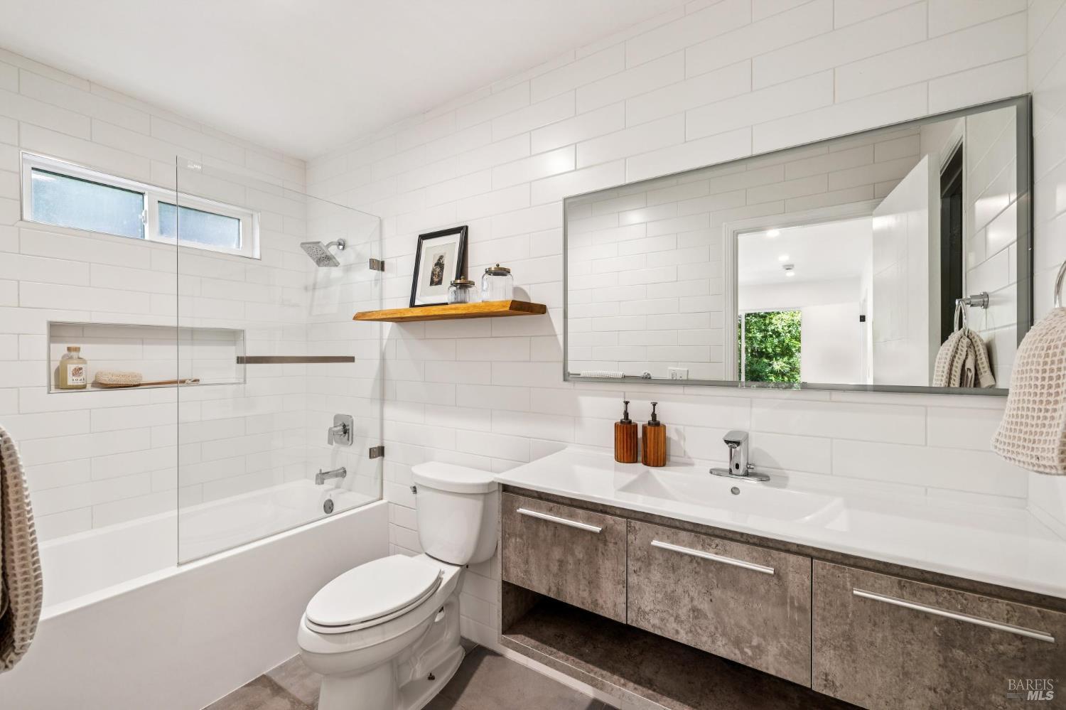 227 Coleman Drive San Rafael, CA 94901 - Photo 8 of 36 a bathroom with a sink a toilet and shower