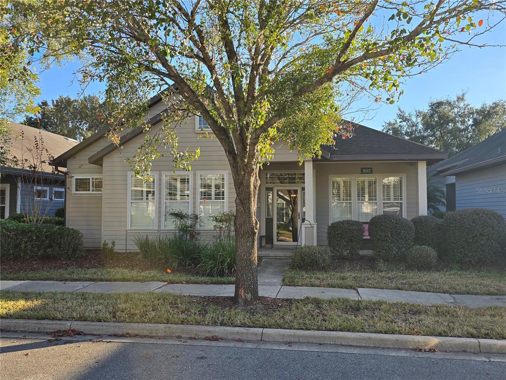 8613 Southwest 76th Place Gainesville, FL 32608 - Photo 22 of 30 a front view of a house with garden