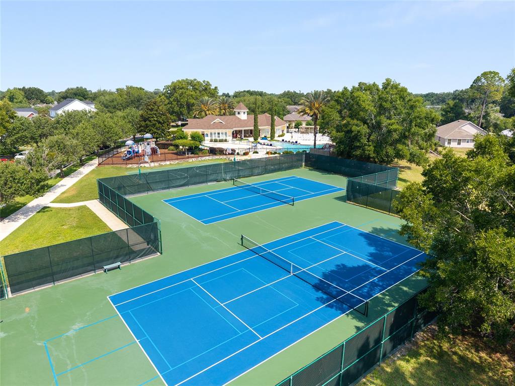8613 Southwest 76th Place Gainesville, FL 32608 - Photo 26 of 30 a view of an outdoor space and tennis court