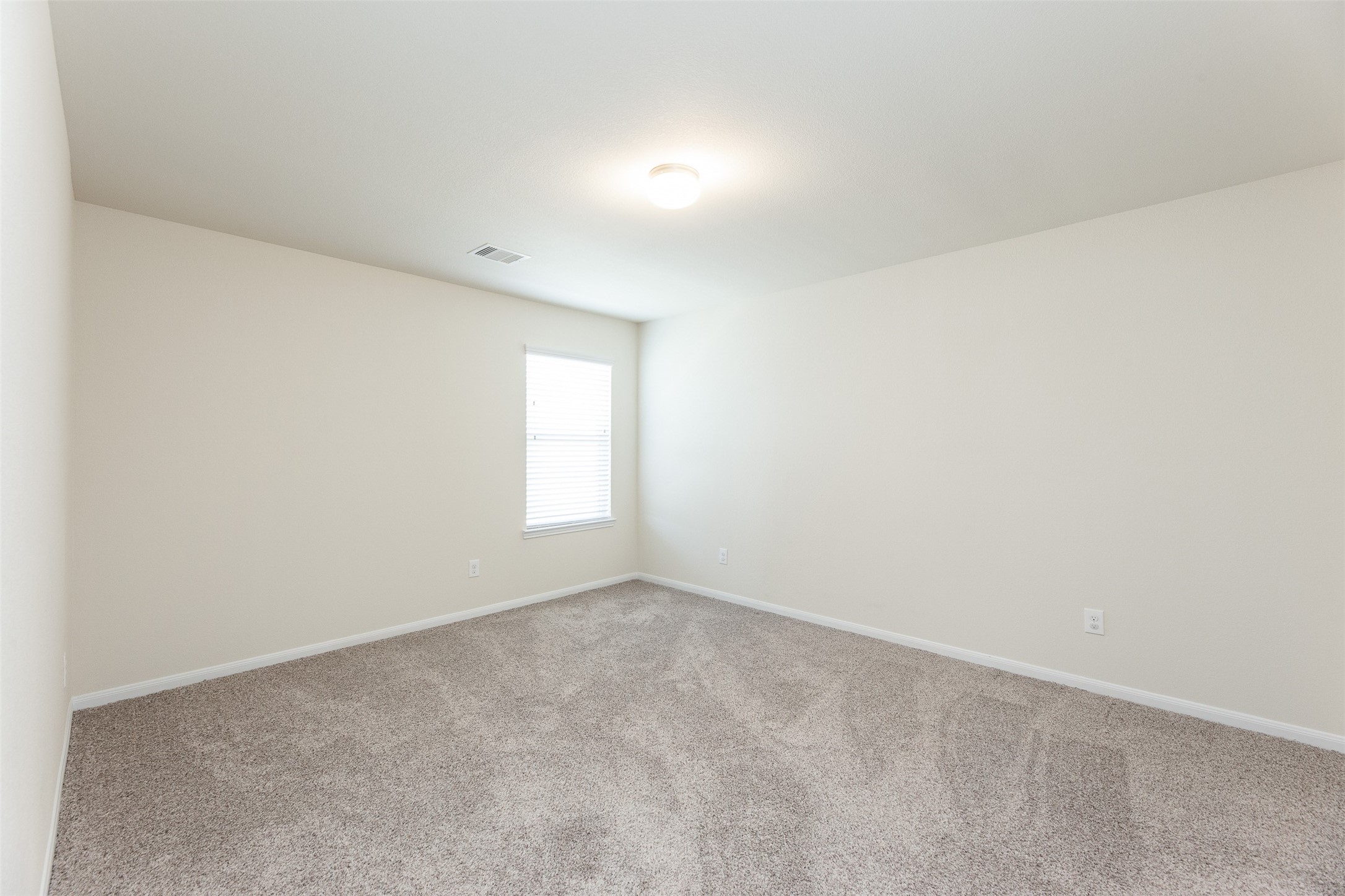 2293 Garden Square Path Spring, TX 77386 - Photo 29 of 32 a view of an empty room with a window