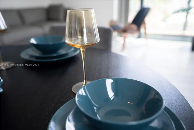 a kitchen with granite countertop a stove top oven sink and cabinets