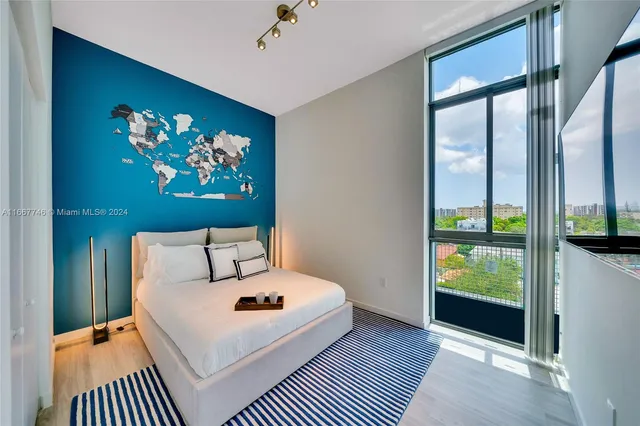 a kitchen with stainless steel appliances granite countertop a sink and a stove
